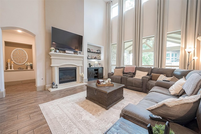 living room featuring a towering ceiling