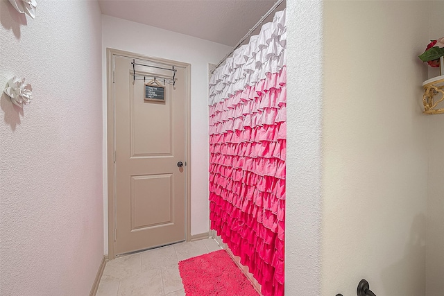 bathroom with tile patterned flooring