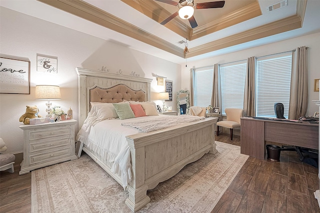 bedroom featuring crown molding, a raised ceiling, ceiling fan, and hardwood / wood-style flooring