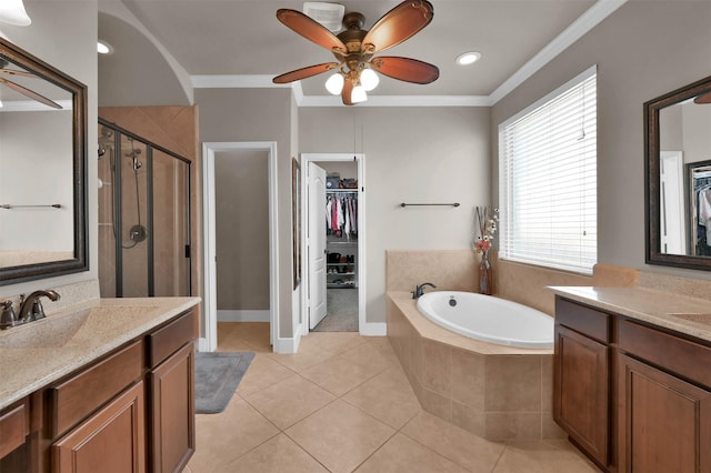 bathroom featuring ornamental molding, plus walk in shower, tile patterned flooring, and vanity