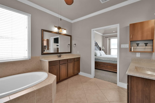 bathroom featuring tiled bath, tile patterned flooring, ornamental molding, vanity, and ceiling fan