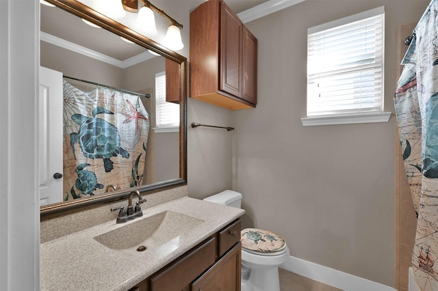 bathroom featuring crown molding, a wealth of natural light, and vanity