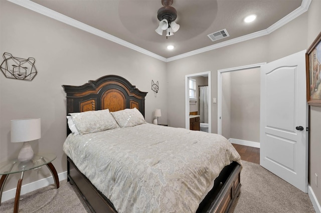 bedroom featuring crown molding, ceiling fan, and ensuite bathroom