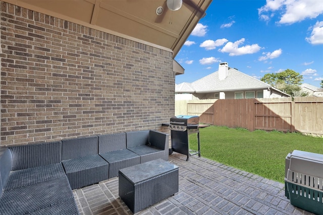 view of patio / terrace featuring ceiling fan, grilling area, and an outdoor living space