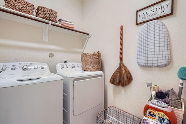 laundry area with laundry area and separate washer and dryer