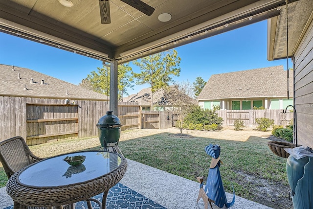 view of patio / terrace with a fenced backyard and a ceiling fan