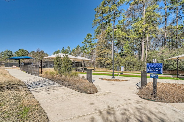 view of home's community featuring curved driveway