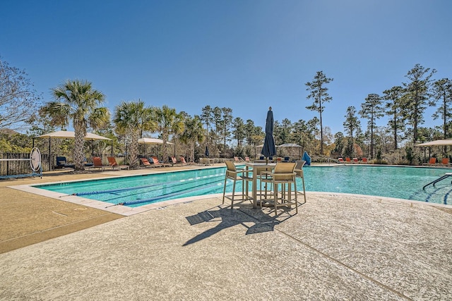 pool with a patio area