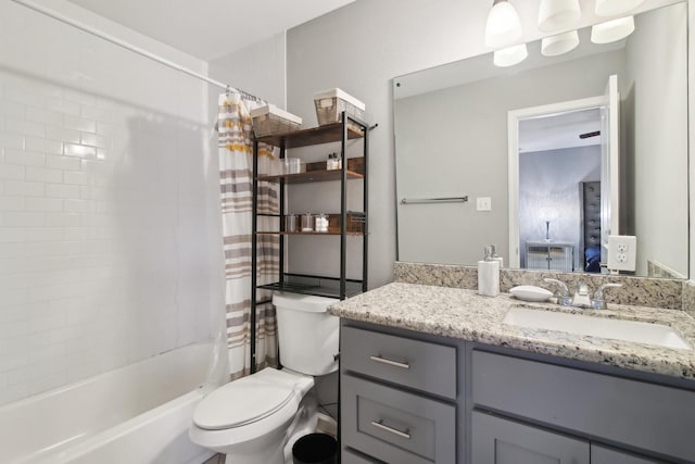 full bathroom featuring vanity, toilet, and shower / tub combo