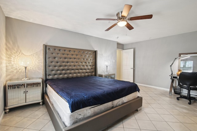 tiled bedroom featuring ceiling fan