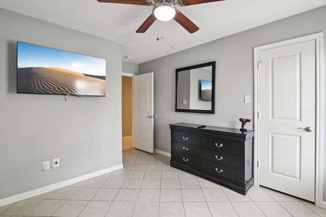 bedroom with ceiling fan and light tile patterned floors