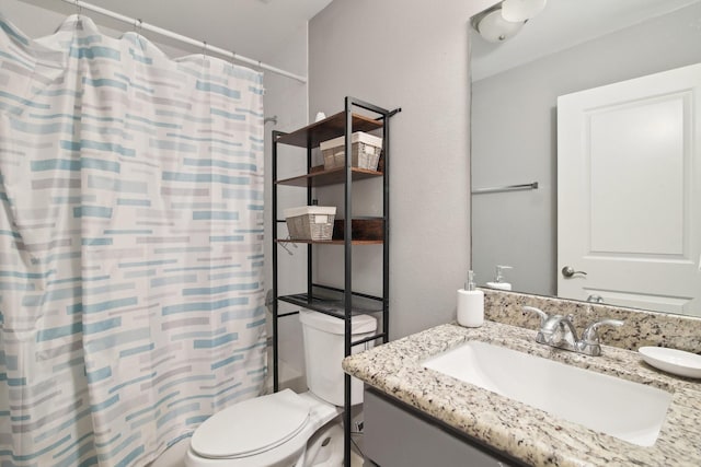 full bathroom featuring vanity, shower / tub combo, and toilet