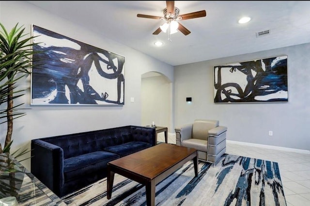 living room with ceiling fan and light tile patterned flooring