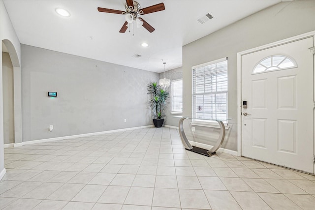 foyer with ceiling fan and light tile patterned floors