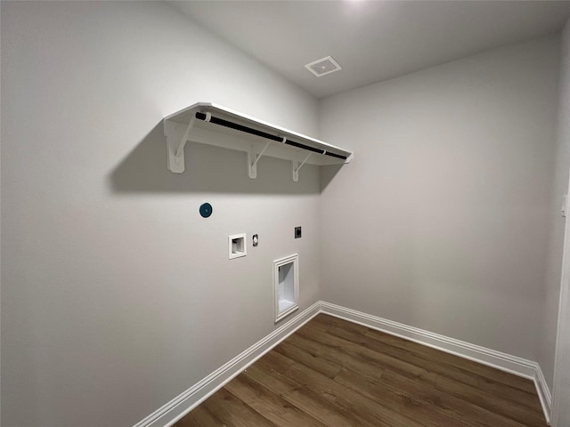 clothes washing area featuring dark hardwood / wood-style floors, washer hookup, hookup for an electric dryer, and hookup for a gas dryer