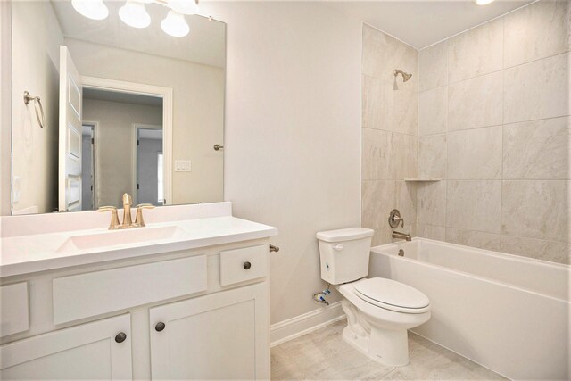 bathroom featuring vanity, bathtub / shower combination, toilet, and baseboards