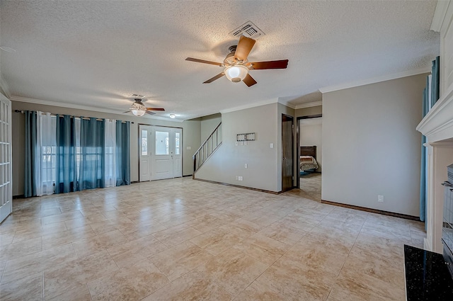 empty room with crown molding, ceiling fan, and a textured ceiling