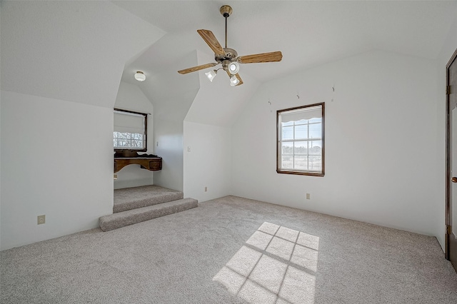 bonus room with ceiling fan, lofted ceiling, and carpet floors