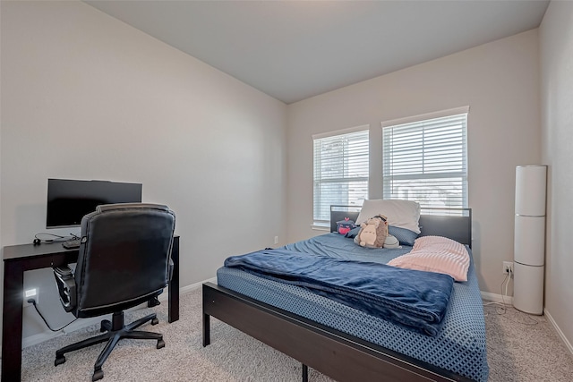 carpeted bedroom featuring vaulted ceiling