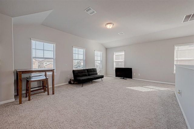 living area with carpet and lofted ceiling