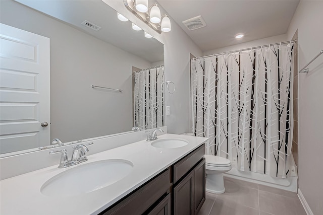 full bathroom featuring shower / bathtub combination with curtain, vanity, tile patterned floors, and toilet