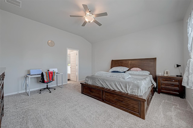 carpeted bedroom with vaulted ceiling, ensuite bathroom, and ceiling fan