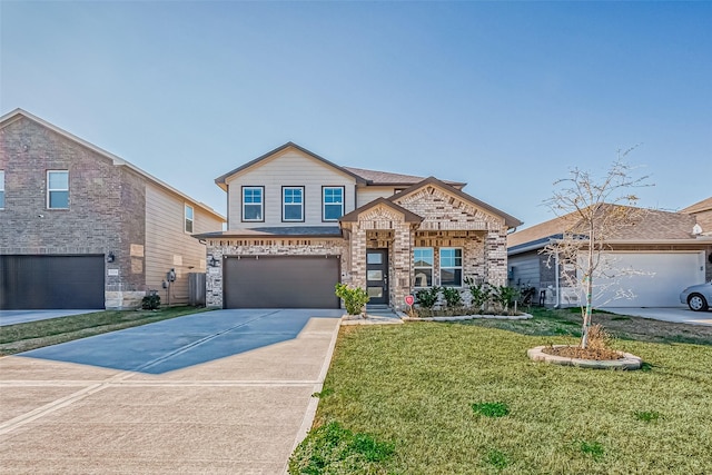 view of front of house featuring a garage and a front yard