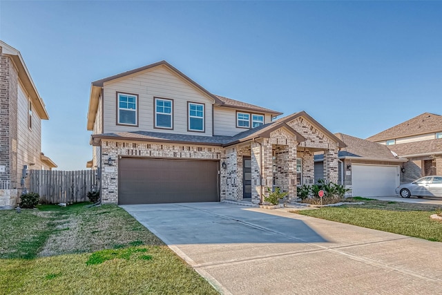 view of front of house featuring a garage and a front yard