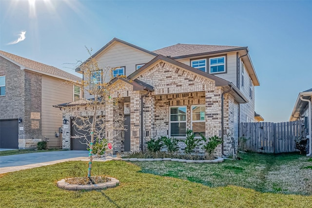 view of front facade featuring a garage and a front yard