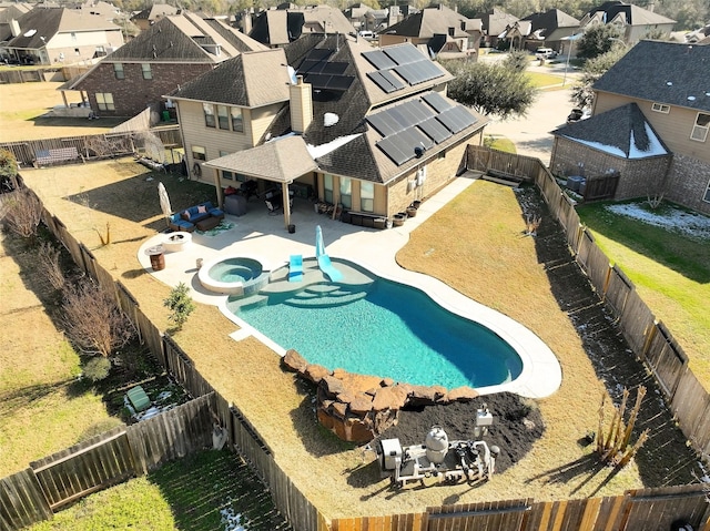 view of pool with an in ground hot tub and a patio