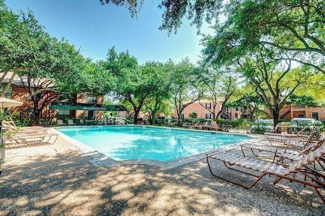 view of swimming pool featuring a patio area