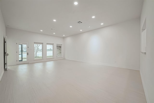 spare room with light hardwood / wood-style floors