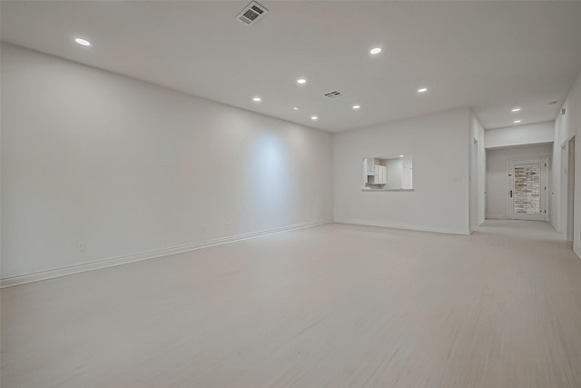 spare room with light hardwood / wood-style flooring