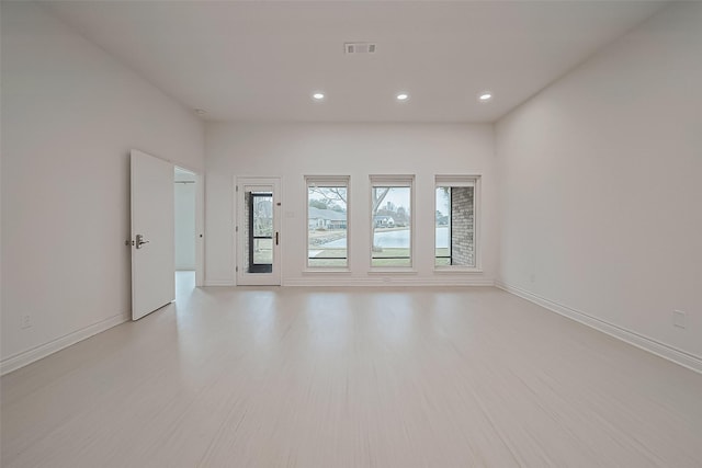 spare room with light wood-type flooring