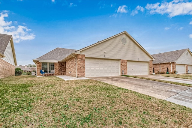 view of front of home with a garage and a front lawn