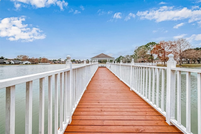 dock area with a gazebo and a water view