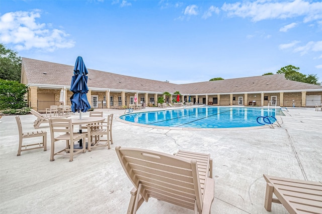 view of swimming pool featuring a patio area