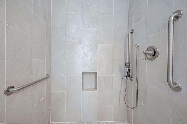 bathroom with tiled shower