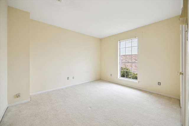 empty room featuring light carpet