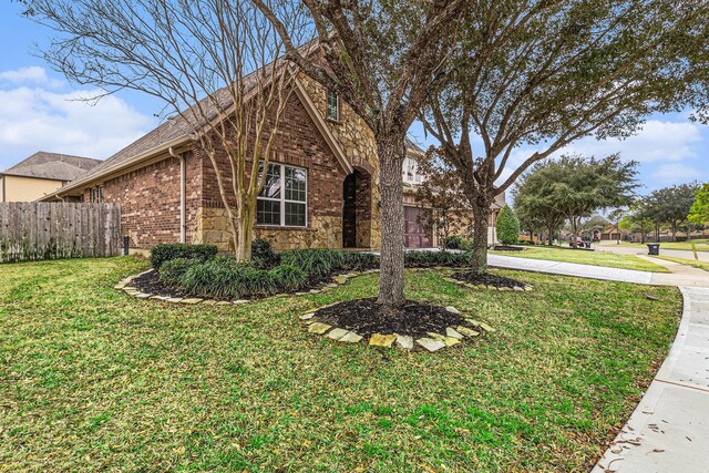 view of property exterior featuring a lawn