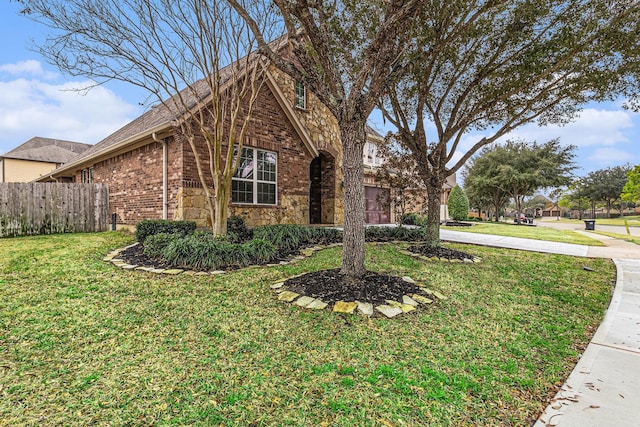 view of side of property with a yard