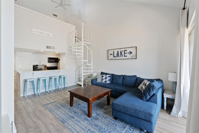 living room with a towering ceiling