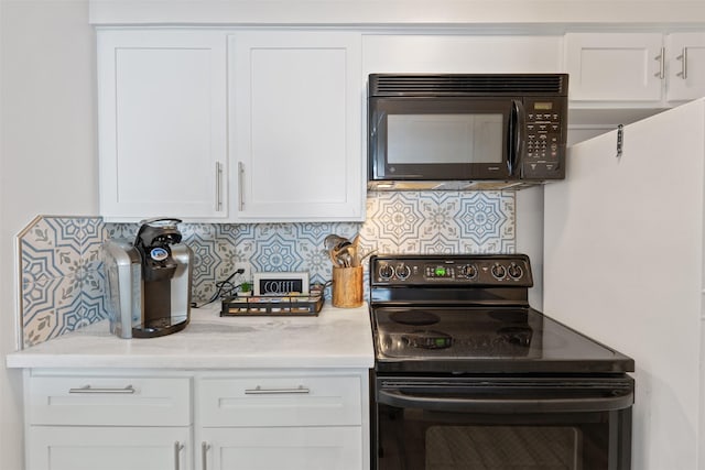 kitchen featuring white cabinetry, backsplash, and black appliances