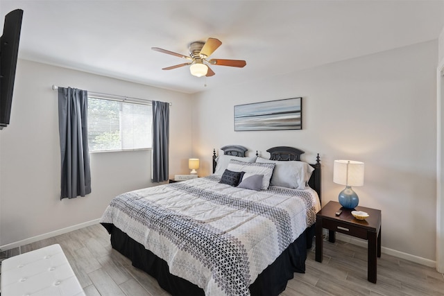 bedroom featuring light wood-type flooring and ceiling fan