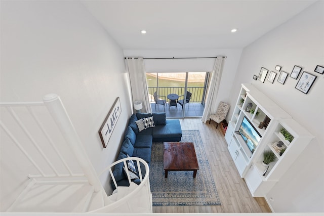 living room with light hardwood / wood-style flooring