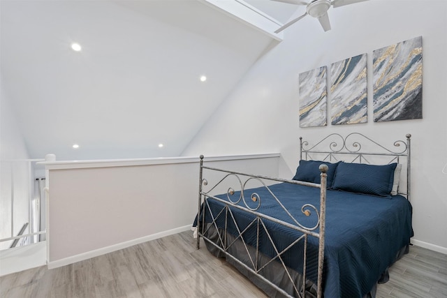 bedroom with wood-type flooring, vaulted ceiling, and ceiling fan