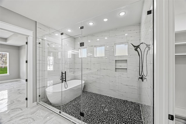 bathroom with shower with separate bathtub