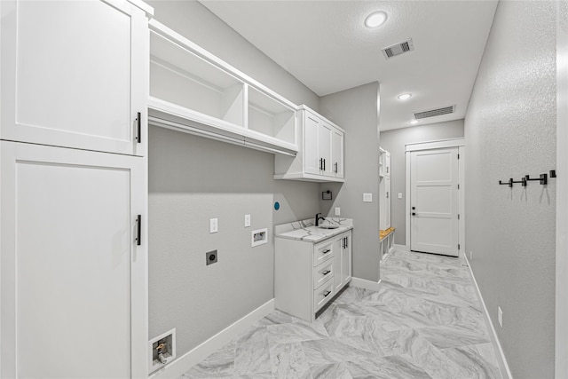 laundry room featuring cabinets, washer hookup, hookup for an electric dryer, and sink