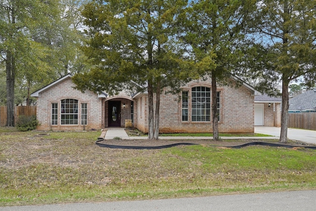 view of front of house with a garage and a front lawn