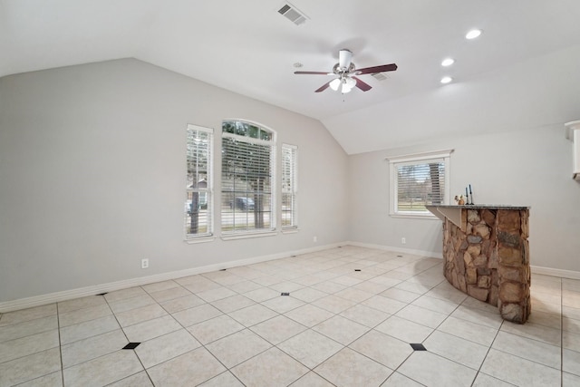 unfurnished living room featuring light tile patterned flooring, ceiling fan, and vaulted ceiling